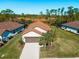 Aerial view of a house with a terracotta roof at 224 Ariano Ave, Nokomis, FL 34275