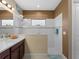 Walk-in shower with tiled walls and glass door at 224 Ariano Ave, Nokomis, FL 34275