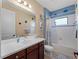 Bathroom with a bathtub, shower, and decorative seashell theme at 224 Ariano Ave, Nokomis, FL 34275