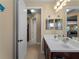 Guest bathroom with a double vanity and decorative seashell theme at 224 Ariano Ave, Nokomis, FL 34275