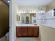 Double vanity bathroom with a walk-in shower at 224 Ariano Ave, Nokomis, FL 34275