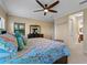 Bright bedroom with a coastal theme and ensuite bathroom at 224 Ariano Ave, Nokomis, FL 34275