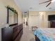 Primary bedroom with dresser and ensuite bathroom at 224 Ariano Ave, Nokomis, FL 34275