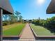 Community bocce ball court with green artificial turf at 224 Ariano Ave, Nokomis, FL 34275