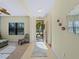Bright and airy entryway with tile floor and seating at 224 Ariano Ave, Nokomis, FL 34275