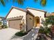Well-maintained house with a brown garage door and landscaping at 224 Ariano Ave, Nokomis, FL 34275