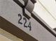 Close-up of the house number, 224, on the exterior wall at 224 Ariano Ave, Nokomis, FL 34275