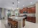 Modern kitchen with granite countertops, stainless steel appliances, and island at 224 Ariano Ave, Nokomis, FL 34275