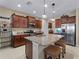 Spacious kitchen with island, granite countertops, and stainless steel appliances at 224 Ariano Ave, Nokomis, FL 34275
