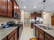 Kitchen with stainless steel appliances and granite countertops at 224 Ariano Ave, Nokomis, FL 34275