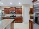 Modern kitchen with stainless steel appliances and granite countertops at 224 Ariano Ave, Nokomis, FL 34275