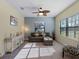 Living room with sofa, chair, and large window at 224 Ariano Ave, Nokomis, FL 34275