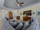 Living room features a sectional sofa and fireplace at 224 Ariano Ave, Nokomis, FL 34275