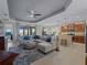 Open living area with sectional sofa and access to outdoor patio at 224 Ariano Ave, Nokomis, FL 34275