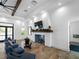 Relaxing lounge area with fireplace and comfortable seating at 224 Ariano Ave, Nokomis, FL 34275