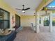 Screened patio with pavers, ceiling fans, and pool access at 224 Ariano Ave, Nokomis, FL 34275