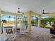 Screened patio with pavers, ceiling fans, and pool access at 224 Ariano Ave, Nokomis, FL 34275
