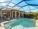 Enclosed pool with adjacent patio and lounge chairs at 224 Ariano Ave, Nokomis, FL 34275