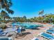 Inviting community pool with plenty of lounge chairs at 224 Ariano Ave, Nokomis, FL 34275
