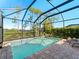 Enclosed pool area with a patio and plenty of sunshine at 224 Ariano Ave, Nokomis, FL 34275
