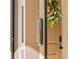 Close up of a screen door with a silver door closer at 224 Ariano Ave, Nokomis, FL 34275