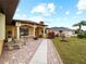 A brick paved walkway leads to the entrance of the house at 2520 S Salford Blvd, North Port, FL 34287