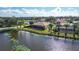 Backyard with pool and canal view in upscale community at 256 Royal Oak Way, Venice, FL 34292