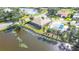 Property showcasing a canal-front location and pool at 256 Royal Oak Way, Venice, FL 34292