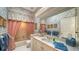 Elegant bathroom with floral wallpaper, a bathtub, and updated vanity at 256 Royal Oak Way, Venice, FL 34292