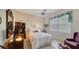 Cozy bedroom featuring a comfortable bed and a seating area at 256 Royal Oak Way, Venice, FL 34292