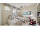 Cozy bedroom with two twin beds and a workspace at 256 Royal Oak Way, Venice, FL 34292