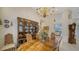 Formal dining room with a large table, chandelier, and built-in hutch at 256 Royal Oak Way, Venice, FL 34292