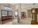 Elegant entryway with double doors, high ceilings & a grand chandelier at 256 Royal Oak Way, Venice, FL 34292