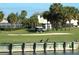 Golf course view with a golf cart and waterfront at 256 Royal Oak Way, Venice, FL 34292
