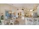 Open kitchen with granite countertops and island, overlooking the Gathering room at 256 Royal Oak Way, Venice, FL 34292