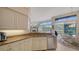 Bright kitchen features granite countertops, stainless steel appliances, and ample cabinetry at 256 Royal Oak Way, Venice, FL 34292