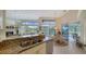 Kitchen boasts granite countertops, breakfast nook, and view of pool and patio at 256 Royal Oak Way, Venice, FL 34292