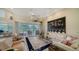 Spacious living room with large windows and water views at 256 Royal Oak Way, Venice, FL 34292