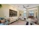 Bright living room featuring a comfortable seating area and large windows at 256 Royal Oak Way, Venice, FL 34292
