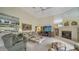 Comfortable living room with fireplace and built-in shelving, perfect for relaxation at 256 Royal Oak Way, Venice, FL 34292