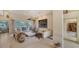 Elegant living room with a large sectional sofa and views to the backyard at 256 Royal Oak Way, Venice, FL 34292