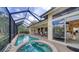 Relaxing pool and spa with a view of the lake at 256 Royal Oak Way, Venice, FL 34292