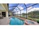 Enjoy a refreshing pool with spa and lake view at 256 Royal Oak Way, Venice, FL 34292