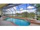 Inviting pool and spa area with screened enclosure at 256 Royal Oak Way, Venice, FL 34292