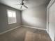 Bedroom with carpeted floor, ceiling fan, and a closet at 2890 Whispering Pine Ln, North Port, FL 34287