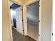 Hallway with access to two bedrooms and a bathroom at 2890 Whispering Pine Ln, North Port, FL 34287