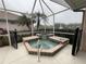 Relaxing hot tub with a glass block water feature at 2890 Whispering Pine Ln, North Port, FL 34287
