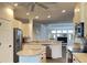 Open concept kitchen with island and stainless steel appliances at 2890 Whispering Pine Ln, North Port, FL 34287