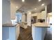 Modern kitchen with stainless steel appliances and an island at 2890 Whispering Pine Ln, North Port, FL 34287