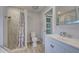 Bathroom with walk-in shower and modern vanity at 3187 Galiot Rd, Venice, FL 34293